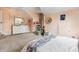 A serene bedroom with peach walls, chair, plush carpet, white dresser and furnishings at 1605 Loblolly Ln, Cumming, GA 30041