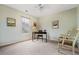 This room features neutral walls, a window, artwork and light-colored carpeting at 1605 Loblolly Ln, Cumming, GA 30041