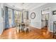 Elegant dining room with hardwood floors, chandelier, and bay windows at 1605 Loblolly Ln, Cumming, GA 30041