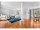 Open-concept living area featuring hardwood floors and ample natural light at 1605 Loblolly Ln, Cumming, GA 30041