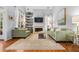 Comfortable living room with neutral walls, fireplace, and windows offering natural light at 1605 Loblolly Ln, Cumming, GA 30041