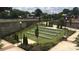 Outdoor amphitheater with tiered seating, landscaping, and wrought iron fencing creating a welcoming space at 3352 Cranston Ln, Kennesaw, GA 30144