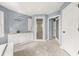 Spacious bathroom with tiled floors, shower stall, modern sink, and fixtures at 3900 Millwood Lane Nw, Lilburn, GA 30047