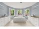 A well-lit bathroom featuring a tub and dual vanities with generous natural light at 3900 Millwood Lane Nw, Lilburn, GA 30047