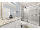 Stylish bathroom with granite counters, modern fixtures, and a tiled shower bath combo at 3900 Millwood Lane Nw, Lilburn, GA 30047