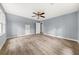 Bright bedroom featuring light wood floors and fresh paint with two closets at 3900 Millwood Lane Nw, Lilburn, GA 30047