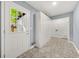 Bright laundry room with tiled floors, large storage cabinet, and door to backyard at 3900 Millwood Lane Nw, Lilburn, GA 30047