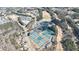 Aerial view shows a community pool, tennis courts, and golf course amid lush greenery at 4978 Millwood Dr, Canton, GA 30114