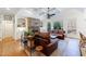 Inviting living room featuring coffered ceilings, stone fireplace, and plentiful natural light at 4978 Millwood Dr, Canton, GA 30114