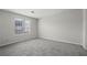 Bright, spacious bedroom featuring neutral paint and plush carpet at 5555 Clover Rise Ln, Norcross, GA 30093