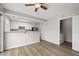 Eat-in kitchen features white cabinets, stainless steel appliances and seamlessly connects to the laundry room at 5555 Clover Rise Ln, Norcross, GA 30093