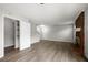 Open-concept living room with new flooring, a brick fireplace, and ample natural light at 5555 Clover Rise Ln, Norcross, GA 30093
