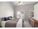 Bedroom with a neutral palette, high ceiling, ceiling fan, carpet and views from two windows at 1204 Village Se Ct, Atlanta, GA 30316