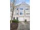 Charming townhome with attached garage and well-maintained landscaping offers curb appeal and convenience at 1204 Village Se Ct, Atlanta, GA 30316