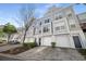 Desirable townhome showcases a well-kept exterior, attached garage, and attractive curb appeal at 1204 Village Se Ct, Atlanta, GA 30316