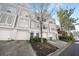 Stylish townhome featuring an attached garage and tasteful landscaping, providing both comfort and aesthetic appeal at 1204 Village Se Ct, Atlanta, GA 30316