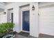 Close up of the blue front door in a white painted brick facade at 1204 Village Se Ct, Atlanta, GA 30316