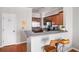 Cozy kitchen area with breakfast bar seating, stainless steel appliances, and efficient layout at 1204 Village Se Ct, Atlanta, GA 30316