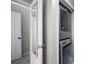 Laundry area featuring stacked washer and dryer, conveniently located in the unit at 1204 Village Se Ct, Atlanta, GA 30316
