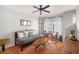 Bright living room with hardwood floors, ceiling fan, and natural light at 1204 Village Se Ct, Atlanta, GA 30316