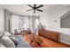 Well-lit living room features hardwood floors, neutral paint, and large windows at 1204 Village Se Ct, Atlanta, GA 30316