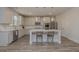 Bright, modern kitchen with white cabinets, stainless steel appliances, and an island with seating at 325 Caledonia Ct, Peachtree City, GA 30269