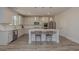 Modern kitchen featuring white cabinets, stainless steel appliances, and a large island with seating at 325 Caledonia Ct, Peachtree City, GA 30269