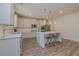 Modern kitchen featuring white cabinets, stainless steel appliances, and a large island with seating at 325 Caledonia Ct, Peachtree City, GA 30269