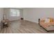 Comfortable living room with an armchair, modern flooring, and ample natural light at 325 Caledonia Ct, Peachtree City, GA 30269