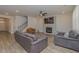 Spacious living room with hardwood floors, fireplace, and comfortable seating at 325 Caledonia Ct, Peachtree City, GA 30269