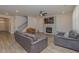 Cozy living room with a fireplace, recessed lighting, and comfortable seating arrangements at 325 Caledonia Ct, Peachtree City, GA 30269