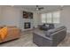 Comfortable living room with fireplace and large windows at 325 Caledonia Ct, Peachtree City, GA 30269