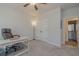 Bright home office with a desk, swivel chair, storage closet and adjacent bathroom at 325 Caledonia Ct, Peachtree City, GA 30269