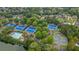 Aerial view of tennis courts and a swimming pool at 5970 Mallet Ct, Cumming, GA 30040