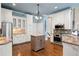 Elegant kitchen with white cabinets, stainless steel appliances, and granite countertops at 5970 Mallet Ct, Cumming, GA 30040