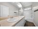 Bathroom with double sinks, wood-look flooring, and a shower-tub combination at 72 Summer Nw Pl, Cartersville, GA 30121