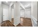 Open entryway with beautiful wood floors, white trim and doors, and a view into adjacent rooms at 72 Summer Nw Pl, Cartersville, GA 30121