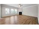 Spacious living room with wood floors, a modern fireplace, a ceiling fan, and lots of natural light at 72 Summer Nw Pl, Cartersville, GA 30121