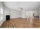 Spacious living room with wood floors, a modern fireplace, a ceiling fan, and lots of natural light at 72 Summer Nw Pl, Cartersville, GA 30121