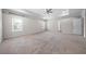 Spacious main bedroom with tray ceiling, windows, and carpet flooring at 72 Summer Nw Pl, Cartersville, GA 30121