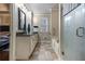 Bathroom featuring dual sinks, walk in shower and separate soaking tub at 9369 Kraft Dr, Winston, GA 30187