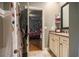 Bathroom vanity with sink, and an open doorway to a bedroom at 9369 Kraft Dr, Winston, GA 30187