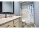 Bathroom featuring large mirror, updated vanity, toilet, tub, and shower with curtain at 9369 Kraft Dr, Winston, GA 30187