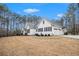 Exterior view of a white ranch home with a well-manicured lawn and attached garage at 9369 Kraft Dr, Winston, GA 30187