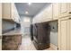 Spacious laundry room with tile floor, washer, dryer, and ample cabinet space at 9369 Kraft Dr, Winston, GA 30187