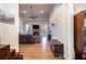 Spacious living room with hardwood floors, stone fireplace, ceiling fan, and neutral paint at 9369 Kraft Dr, Winston, GA 30187