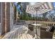 Outdoor back deck that includes a table with an umbrella and a seating area at 1059 Hedge Rose Ne Ct, Atlanta, GA 30324