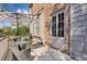 Outdoor back deck that includes a table with an umbrella and a seating area with brick house in the background at 1059 Hedge Rose Ne Ct, Atlanta, GA 30324