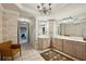 Bright bathroom featuring dual sinks, tiled floors, and decorative wallpaper at 1059 Hedge Rose Ne Ct, Atlanta, GA 30324