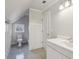 Bright bathroom with white cabinets, neutral walls and accent flooring at 1059 Hedge Rose Ne Ct, Atlanta, GA 30324